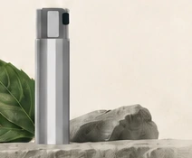 A compact silver spray atomizer.