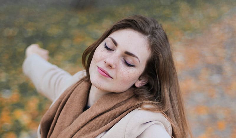 woman enjoying calm with on cbd lotion